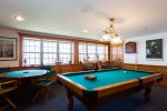 Downstairs game room with pool table and bar